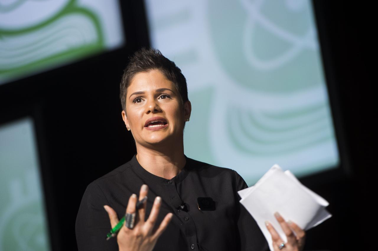 Mónica Feliú-Mójer giving a presentation.