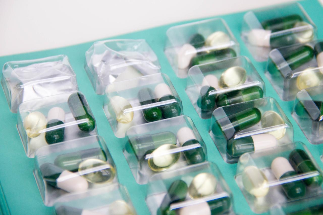 Different shaped pills in packaging.