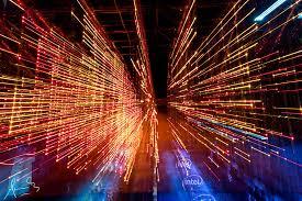 Neon orange and blue lights rendered to represent the digital rainforest.