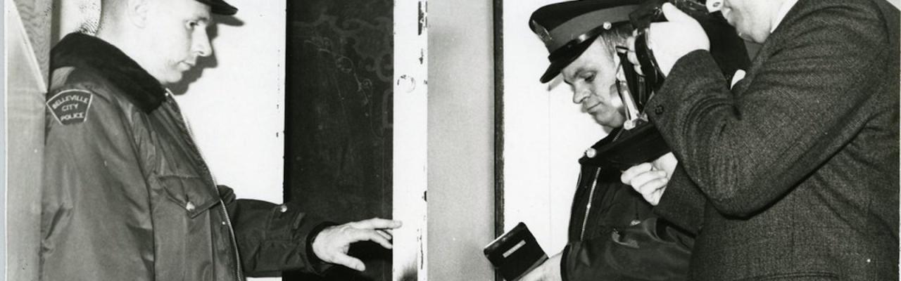 Black and white photo of a police officer.