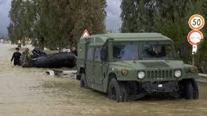 Military truck submerged in a flooded area. 