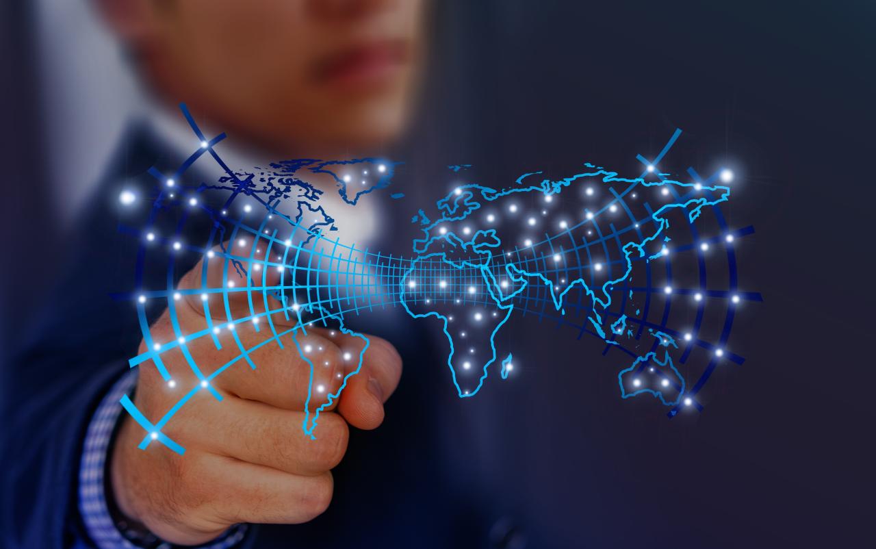 Rendering of person pointing at a glowing map.
