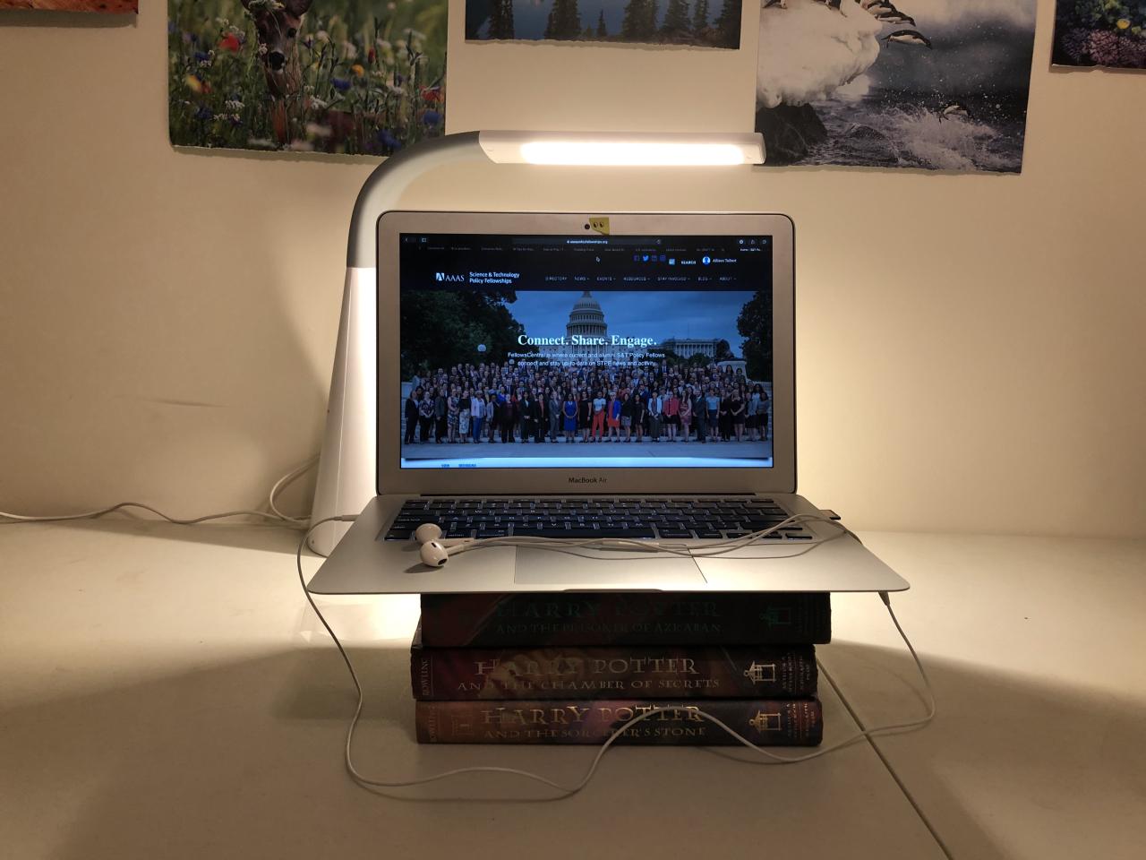 A video interview set up of a lap top on a stack of books.