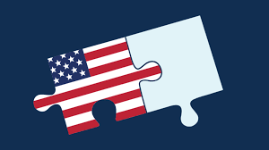 USA Jobs logo of two puzzle pieces fitting together. The piece on the left has the pattern of the American flag and the piece on the right is blank.