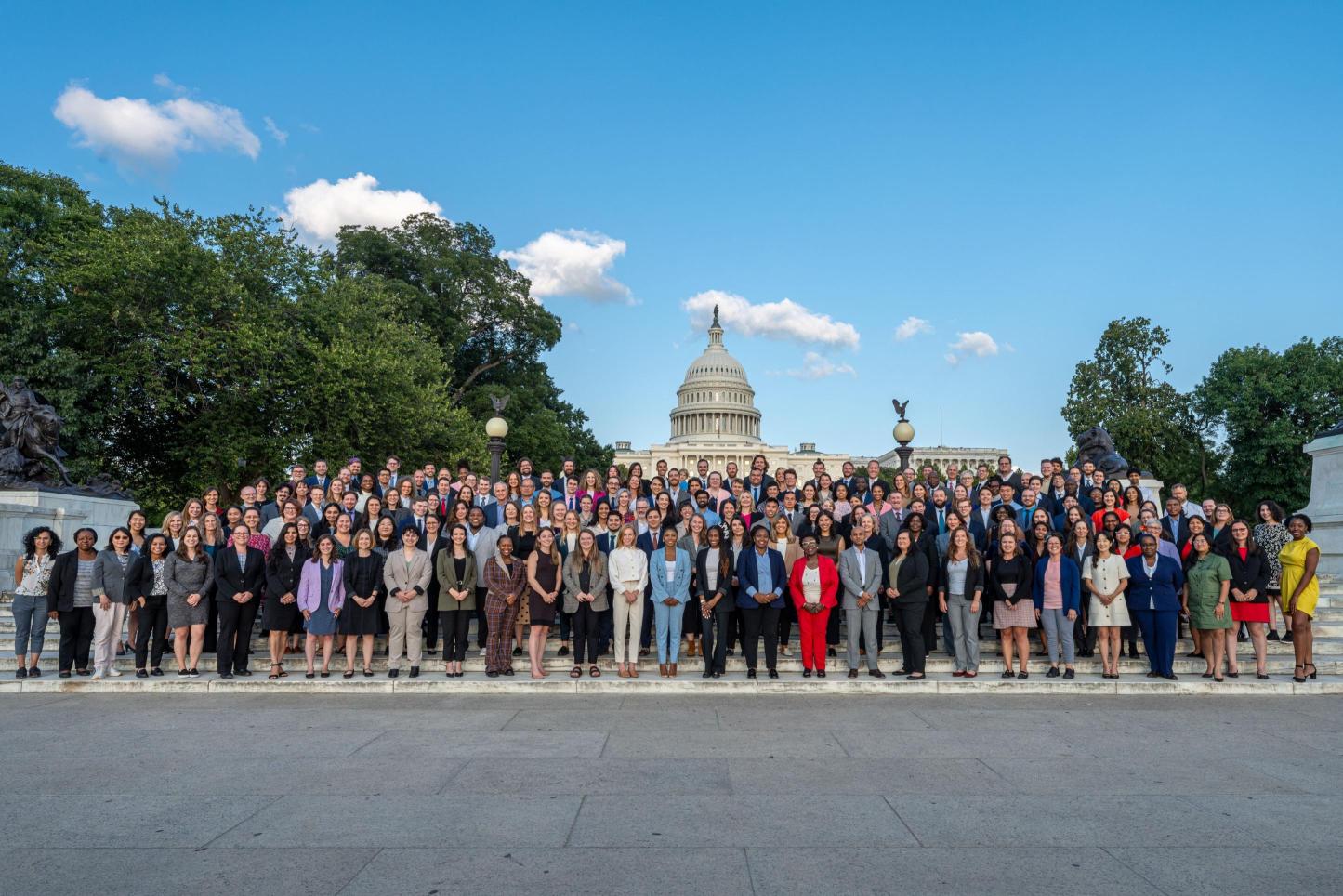 Fellows standing in front of the capitol building