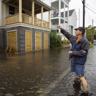 Tony Bartelme tests floodwaters for fecal contamination for his "Rising Waters" series in May