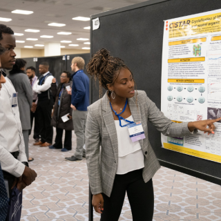 Woman presents research at the Emerging Researchers National Conference in STEM