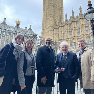 Group of STPF staff in the UK with Lord Des Browne.