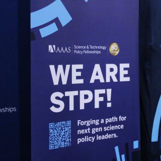 Blue STPF pull-up banner that says "We are STPF!" in bold. 
