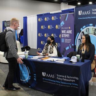STPF staff working the booth at a conference. 