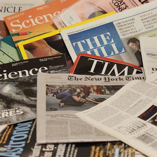 Various print media scattered in a pile.