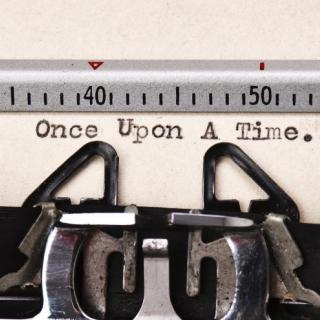 Close up of a typewriter, with the text "Once Upon a Time."