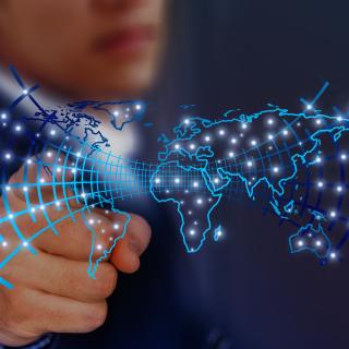 Rendering of person pointing at a glowing map.