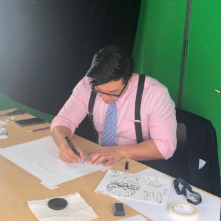 STPF fellow Vince Tedjasaputra writing at a desk.