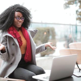 Woman sitting outside in front of a laptop, Andrea Piacquadio, Pexels