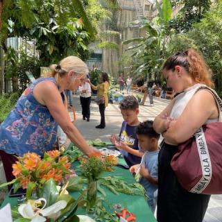 Devin Reese showing plants to visitors